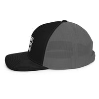 a black and grey hat on a white background