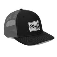 a black and grey hat with a white patch on the front