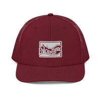 a maroon trucker hat with a white logo on the front