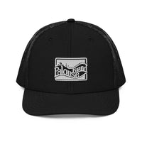 a black trucker hat with a white logo