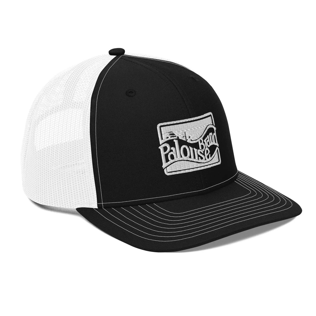 a black and white trucker hat with a white patch on the front