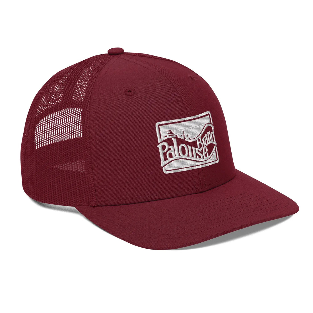a red trucker hat with a white logo on the front