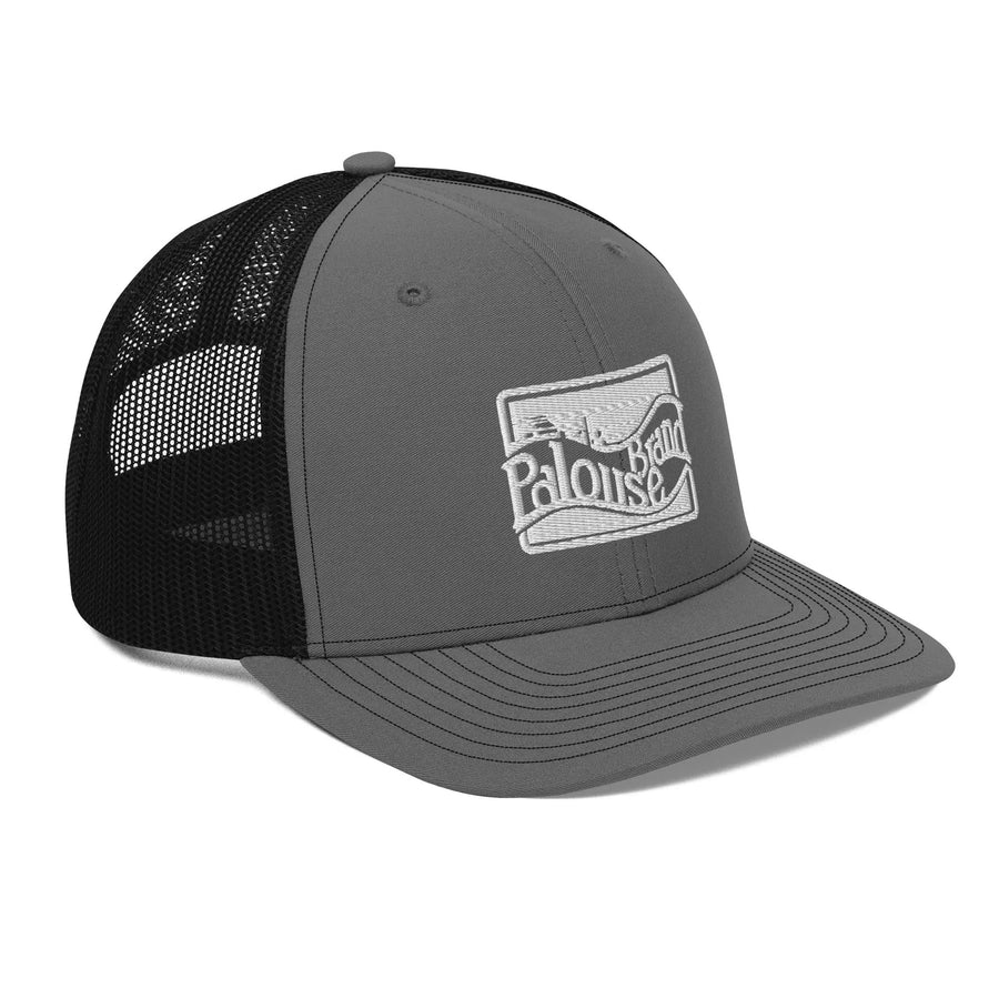a gray and black trucker hat with a white logo