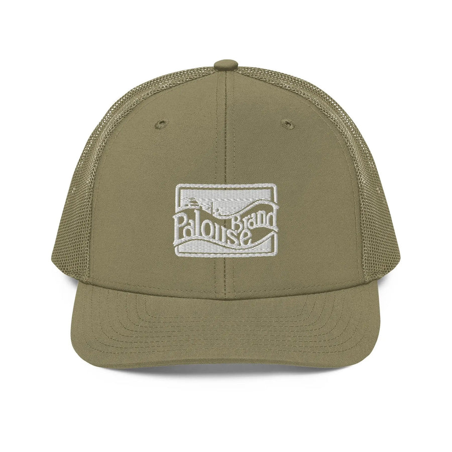 a khaki green trucker hat with a white logo